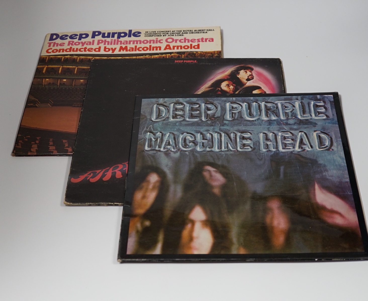 Three Deep Purple LP record albums; Machine Head (TPSA7504) with laminated cover and fold out lyric sheet, fireball (SHVL793) with textured gate fold, cover and Concerto for group and Orchestra (SHVL767) in gatefold cove